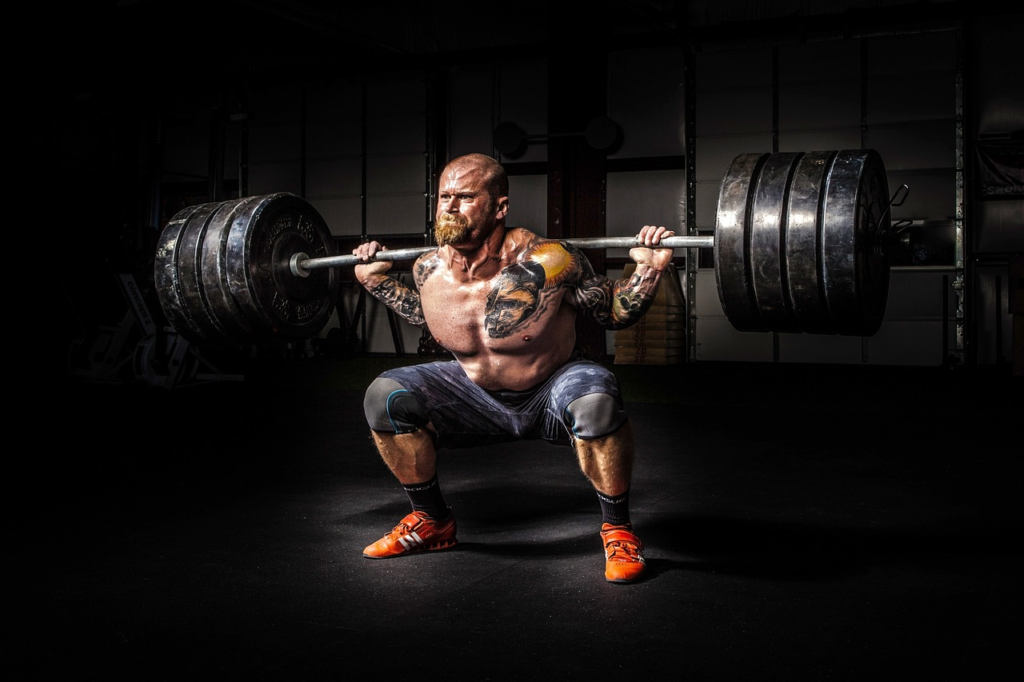 An image featuring a dynamic athlete mid-workout, surrounded by high-tech fitness equipment and recovery tools, showcasing their determination and commitment to achieving peak performance
